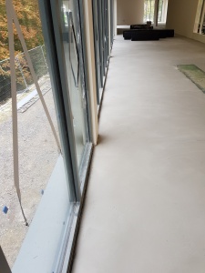 devon installation- concrete floor screaded to imporve levels.